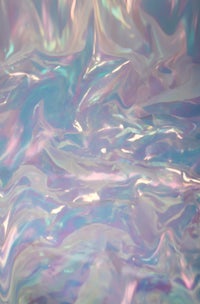 an image of a pink and blue holographic surface