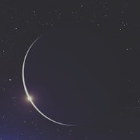 a crescent moon with stars in the background